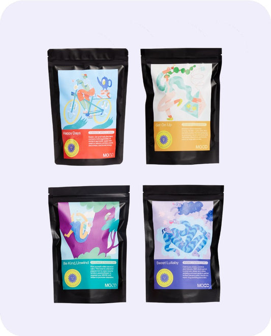 Four colorful MOOD Tea Pouch bags with abstract designs on a light purple background